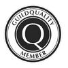 A circular black and white badge with the text "GuildQuality Member" and a large letter "Q" in the center.